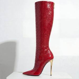 Red knee-high boot with high heel on a white background