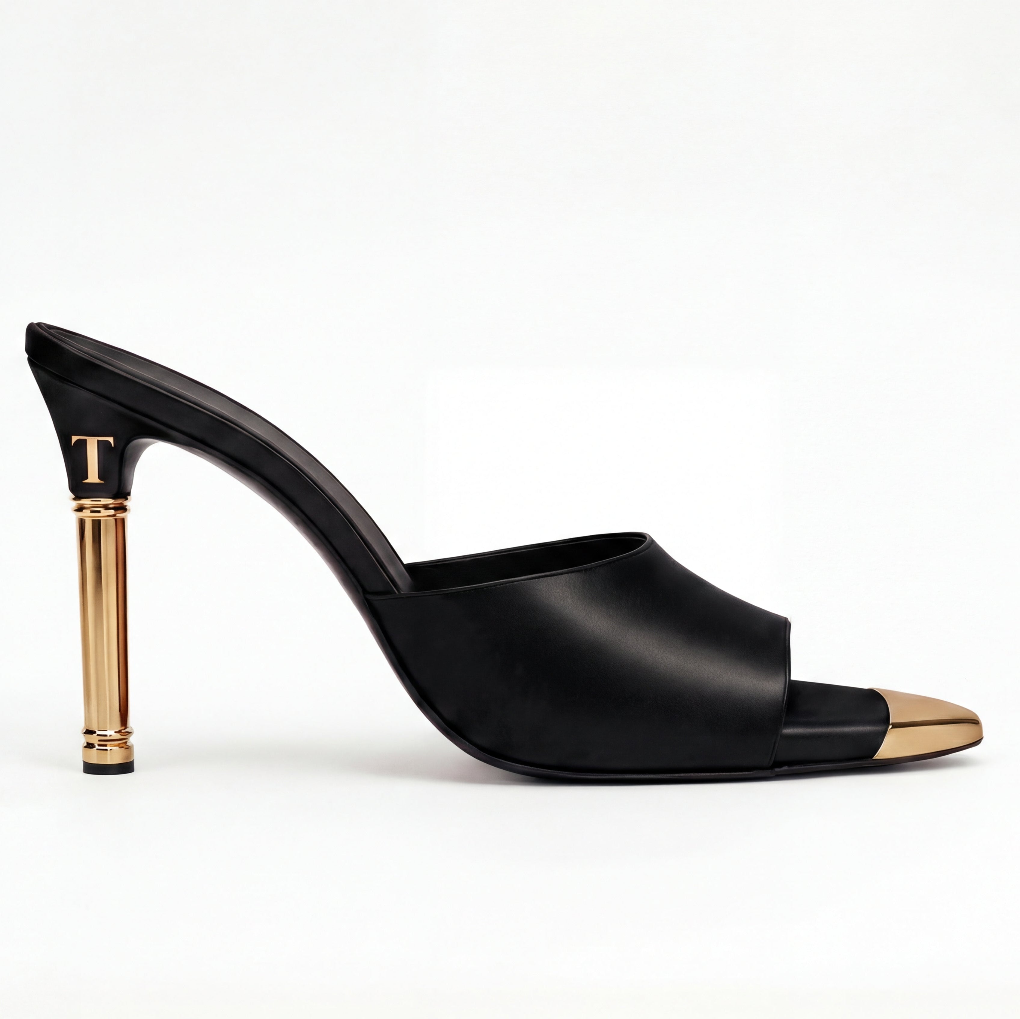 Black high-heeled shoe with gold heel on a white background