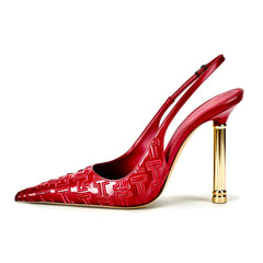 Red high-heeled shoe with gold heel on a white background